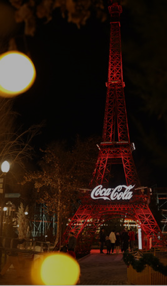 Coca-Cola tower with festive lights in the evening at Central Park