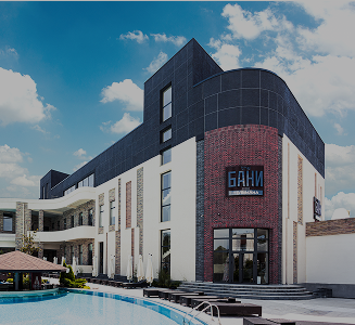 Facade of The BANI Tashkent bath complex with a pool