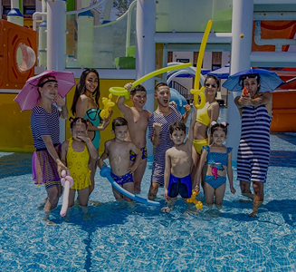 Children and parents enjoying the kids' area with fountains and slides at the 'More' complex