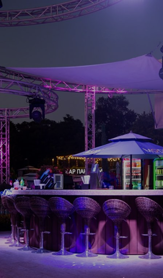 Bar area of the 'More' water complex with purple lighting in the evening